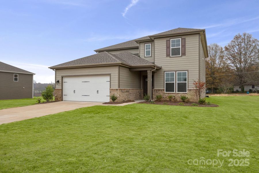 Front exterior of a new home in Running Creek, Locust, NC, highlighting curb appeal (Image 15). Front exterior of a new home in Running Creek, Locust, NC, highlighting curb appeal (Image 15).