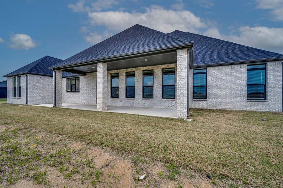 Front exterior of a new home in Springside Estates II, Waxahachie, TX, highlighting curb appeal (Image 15).