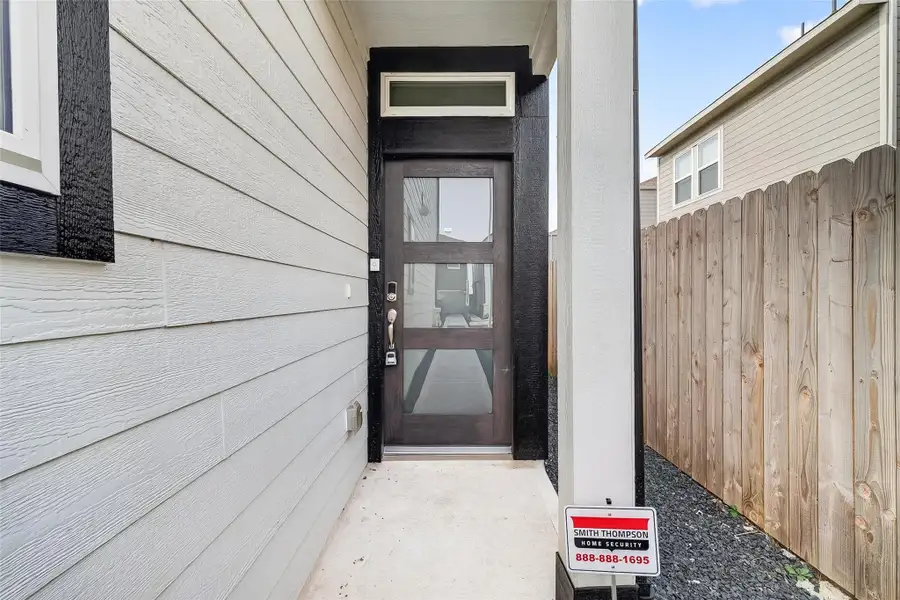 Exterior details and patio area of a home in McClendon Park Village, Houston (Image 4).