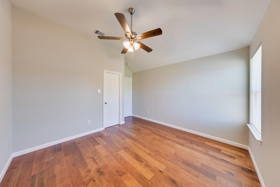 Rich, warm-toned flooring throughout the second floor adds a cozy and inviting feel to all the private upstairs living spaces.