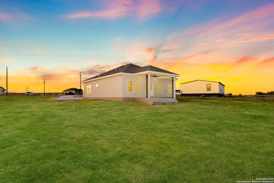 Front exterior of a new home in , La Vernia, TX, highlighting curb appeal (Image 26).