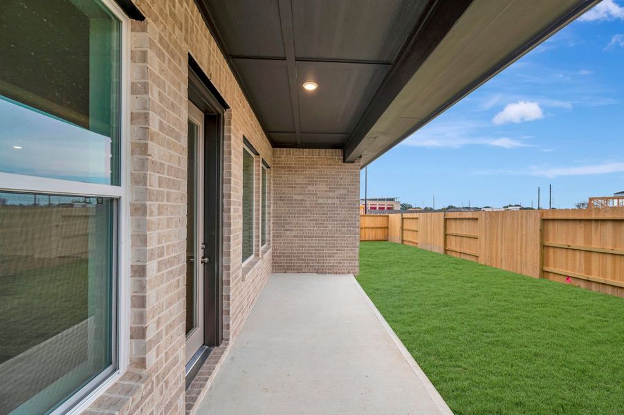 Exterior details and patio area of a home in The Grand Prairie - Retreat Collection, Hockley (Image 4).