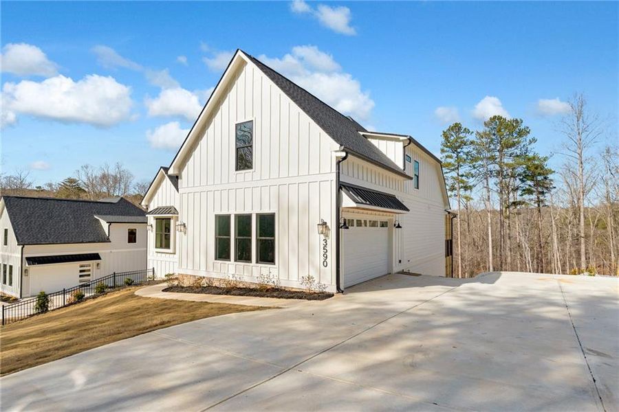 Front exterior of a new home in , Cumming, GA, highlighting curb appeal (Image 25).