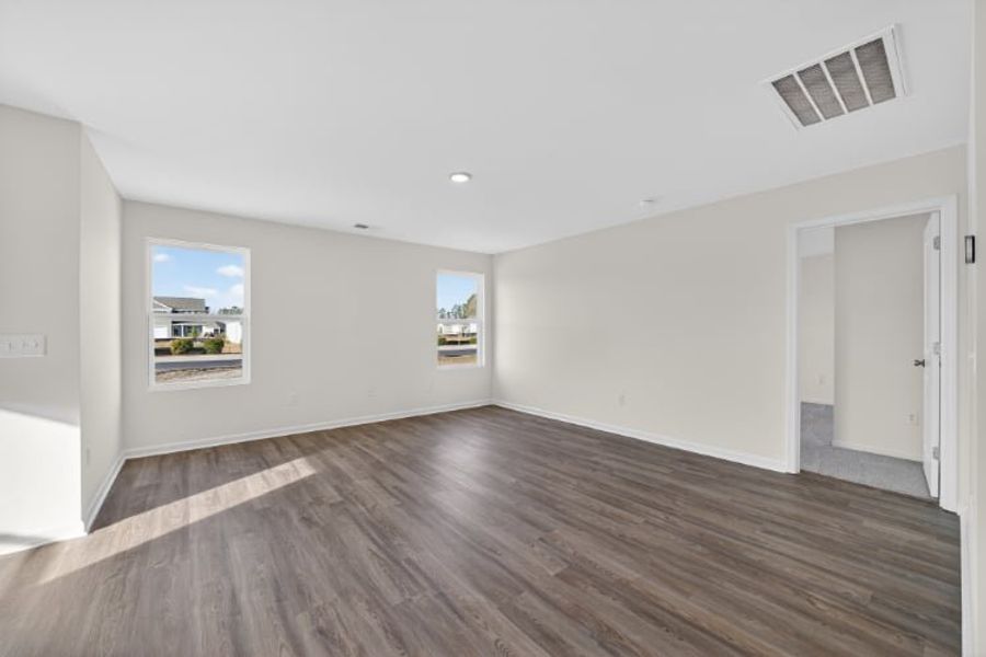 A room with a wood floor and a wood floor.