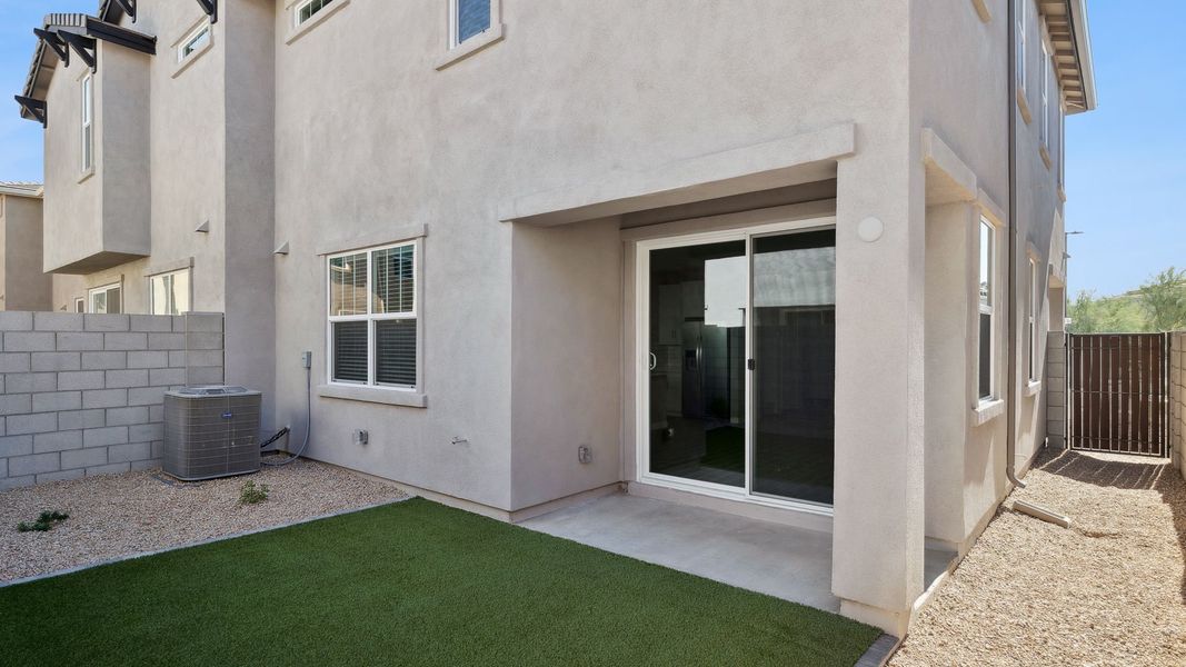 Exterior details and patio area of a home in Talinn Towns at Desert Ridge, Phoenix (Image 20).