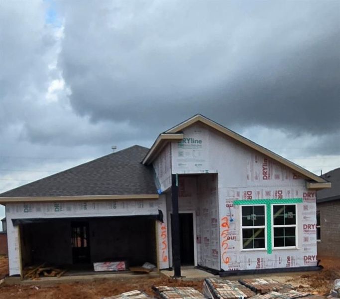 Front exterior of a new home in Sunterra, Katy, TX, highlighting curb appeal (Image 63). Front exterior of a new home in Sunterra, Katy, TX, highlighting curb appeal (Image 63).