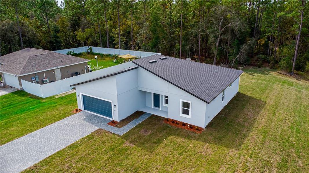 Front exterior of a new home in , Ocala, FL, highlighting curb appeal (Image 1).
