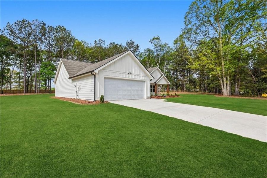 Front exterior of a new home in , Hartwell, GA, highlighting curb appeal (Image 23).