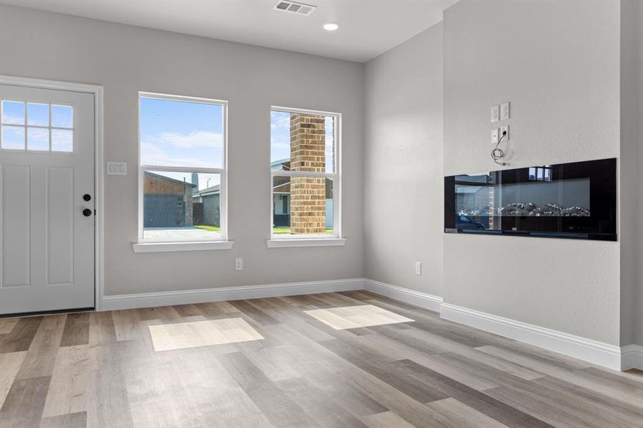 Entryway with wood finished floors, baseboards, and recessed lighting Entryway with wood finished floors, baseboards, and recessed lighting
