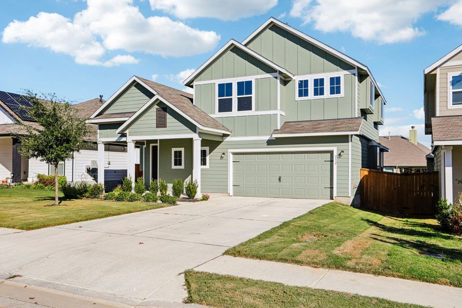 Front exterior of a new home in Orchard Ridge, Liberty Hill, TX, highlighting curb appeal (Image 19).