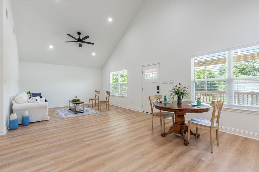 Another view of the large open living room and dining room space.