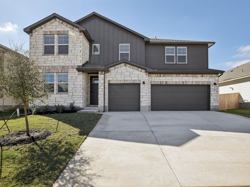 Front exterior of a new home in Opal Meadows, Kyle, TX, highlighting curb appeal (Image 1). Front exterior of a new home in Opal Meadows, Kyle, TX, highlighting curb appeal (Image 1).