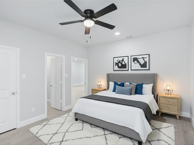 Bedroom featuring light wood-style floors, a ceiling fan, and recessed lighting