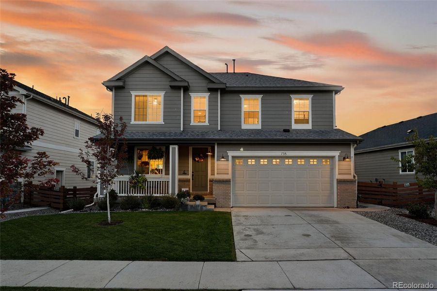 Front exterior of a new home in Colliers Hill, Erie, CO, highlighting curb appeal (Image 1). Front exterior of a new home in Colliers Hill, Erie, CO, highlighting curb appeal (Image 1).