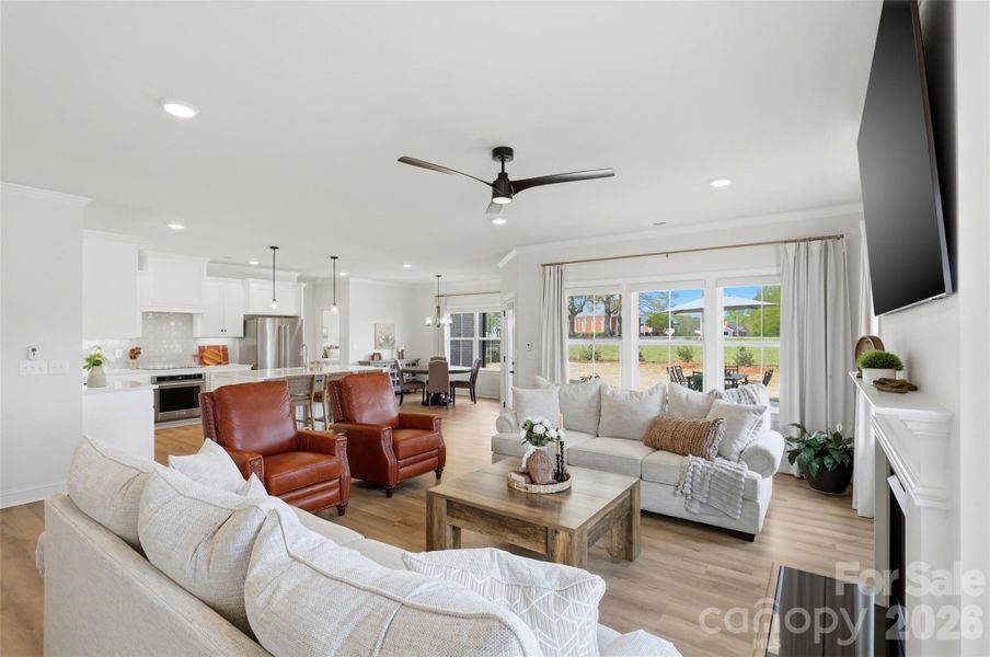 Bright, open-concept living space flows seamlessly into the kitchen and dining area.