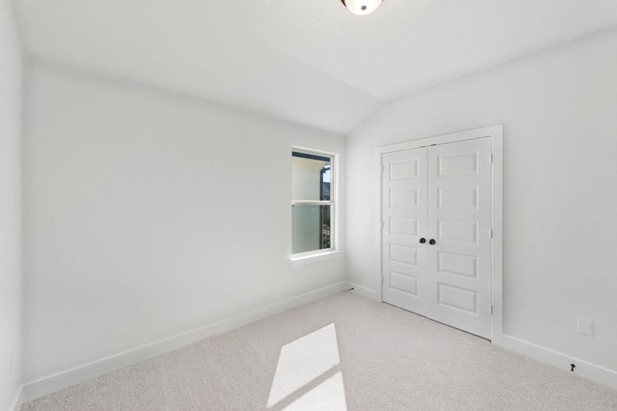 Spacious, unfurnished interior of a new home in The Colony, Bastrop (Image 27).