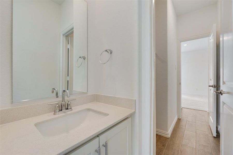 Bathroom featuring hardwood / wood-style floors and vanity