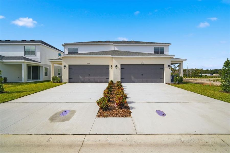 Front exterior of a new home in , Parrish, FL, highlighting curb appeal (Image 25). Front exterior of a new home in , Parrish, FL, highlighting curb appeal (Image 25).