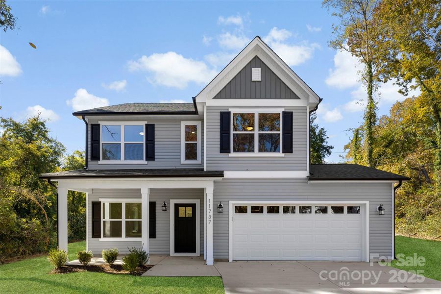 Front exterior of a new home in , Huntersville, NC, highlighting curb appeal (Image 20).