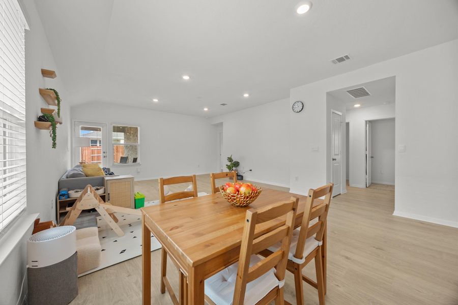 Dining room featuring light wood finished floors and recessed lighting