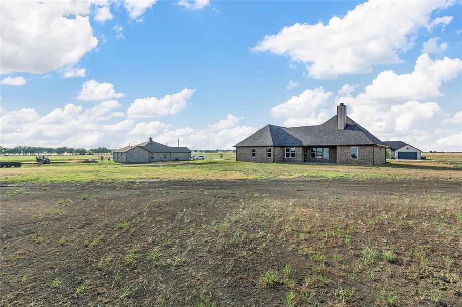 View of yard with a rural view