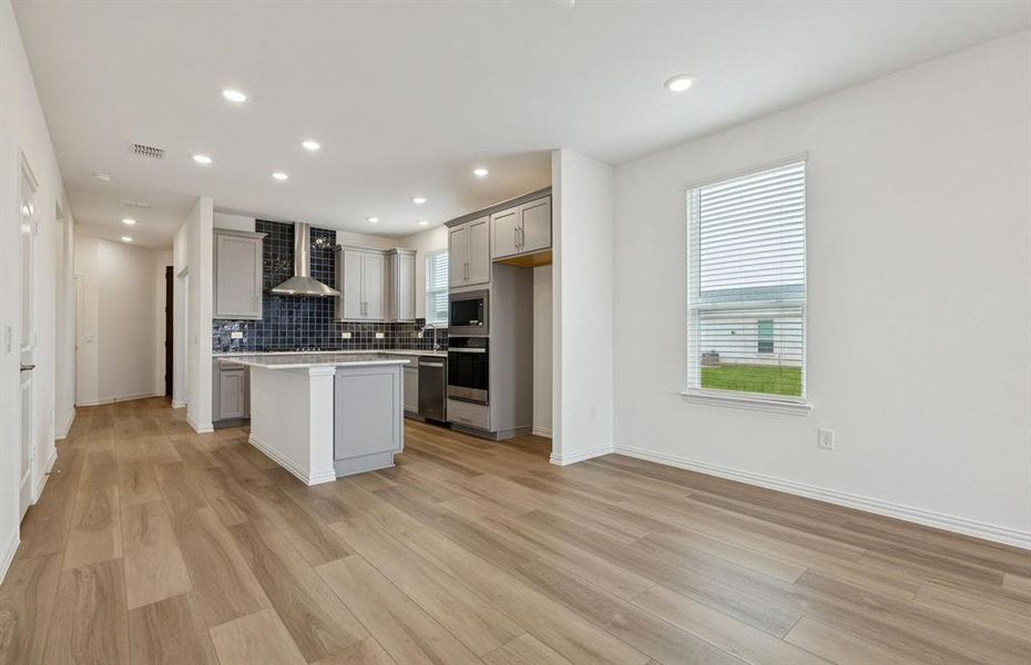 Kitchen overlooks cafe dining space