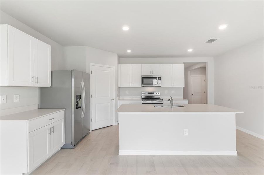 Furnished interior view inside a new home in Burnt Store Village, Punta Gorda (Image 7). Furnished interior view inside a new home in Burnt Store Village, Punta Gorda (Image 7).