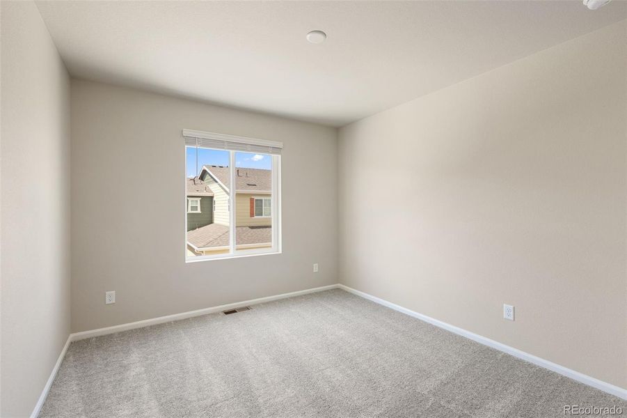 Spacious, unfurnished interior of a new home in Woodrose at Painted Prairie, Aurora (Image 18).