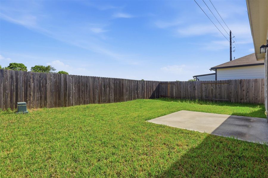 Exterior details and patio area of a home in Barrett Crossing, Crosby (Image 15).