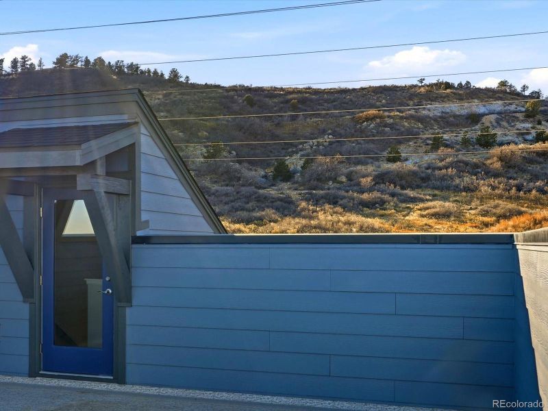 Exterior details and patio area of a home in Three Hills, Morrison (Image 21).