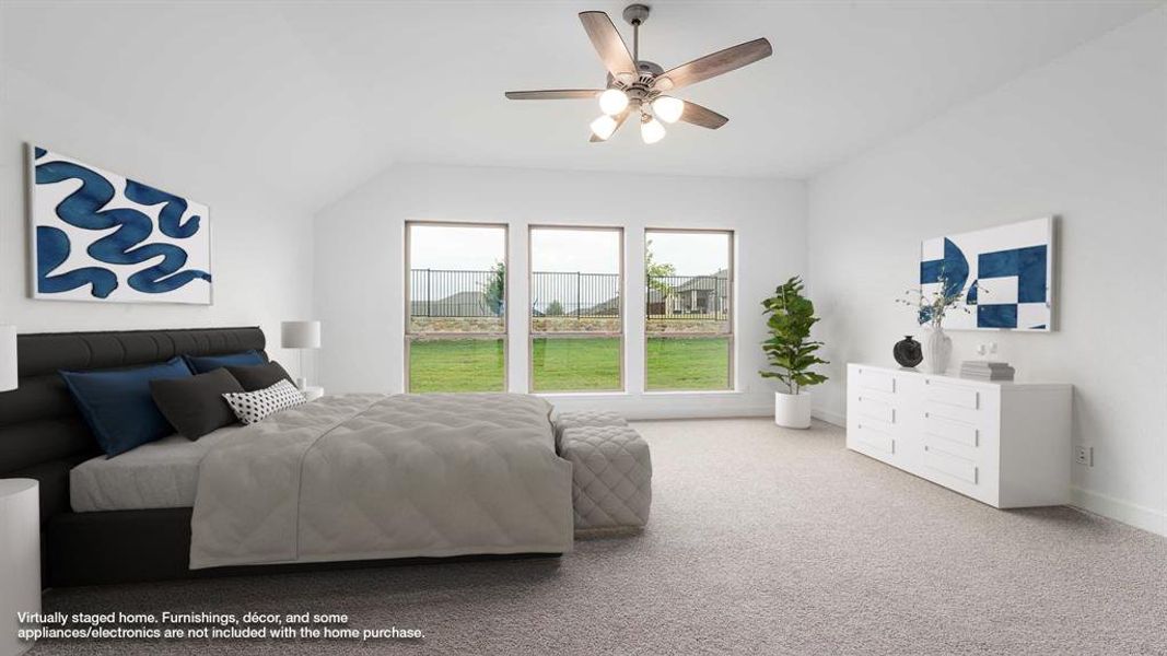 Bedroom with carpet flooring, ceiling fan, and lofted ceiling