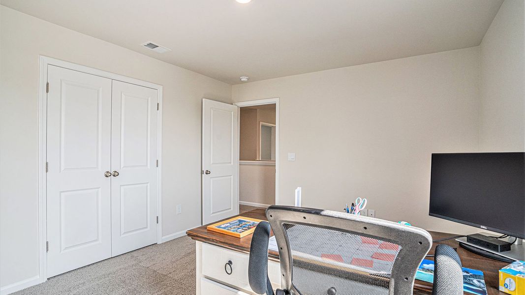 Representative furnished interior of a home built from the MANNING by D.R. Horton in Jordanville Farms, Galivants Ferry (Image 10).