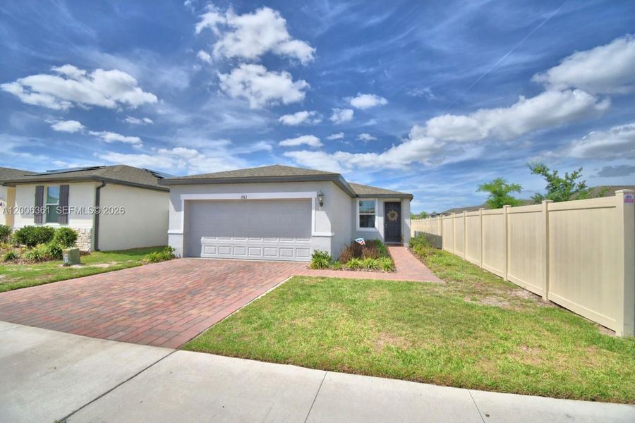 Front exterior of a new home in Lake Deer Estates - Classic Series, Kissimmee, FL, highlighting curb appeal (Image 25).