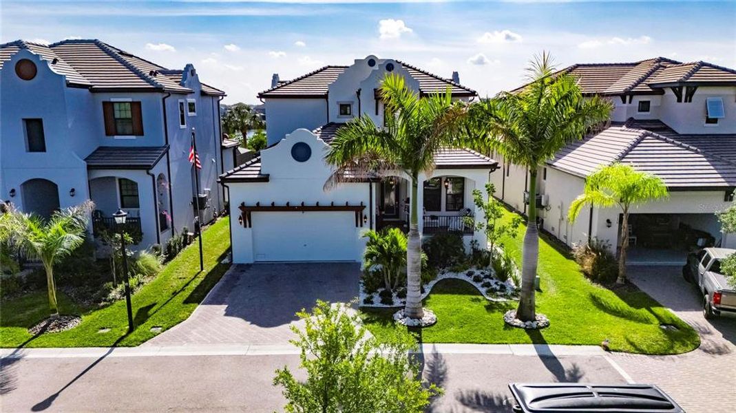 Front exterior of a new home in SouthShore Yacht Club: Somerset Preserve, Ruskin, FL, highlighting curb appeal (Image 26).
