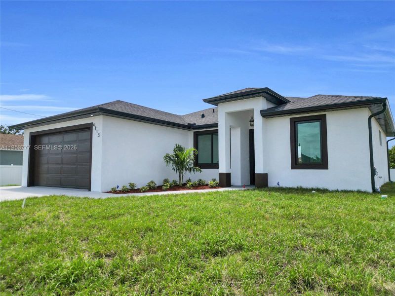 Front exterior of a new home in , Lehigh Acres, FL, highlighting curb appeal (Image 20). Front exterior of a new home in , Lehigh Acres, FL, highlighting curb appeal (Image 20).