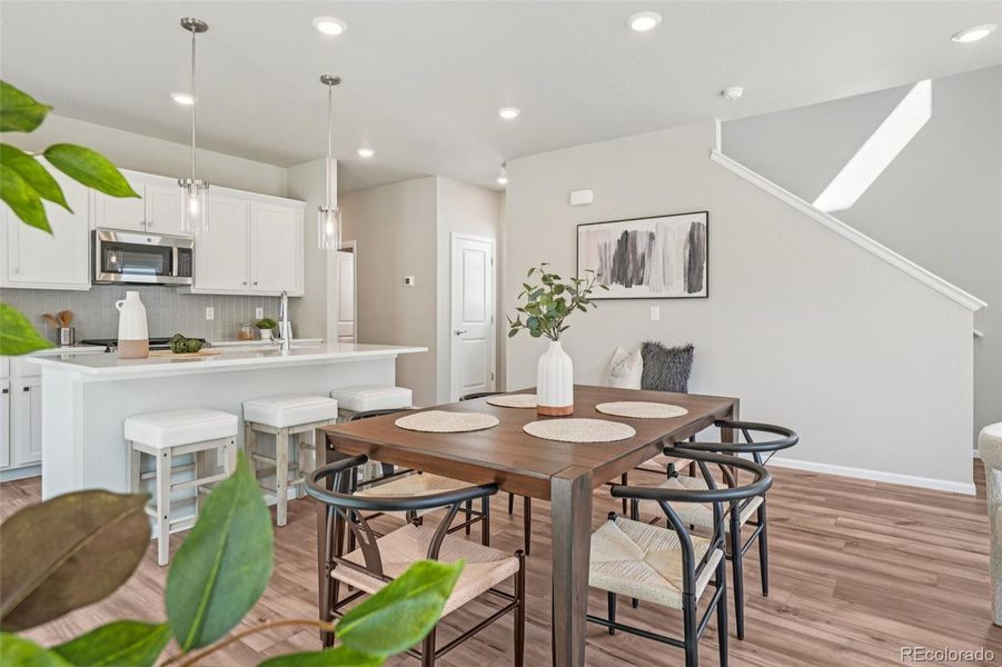 Furnished interior view inside a new home in Woodrose at Painted Prairie, Aurora (Image 13).