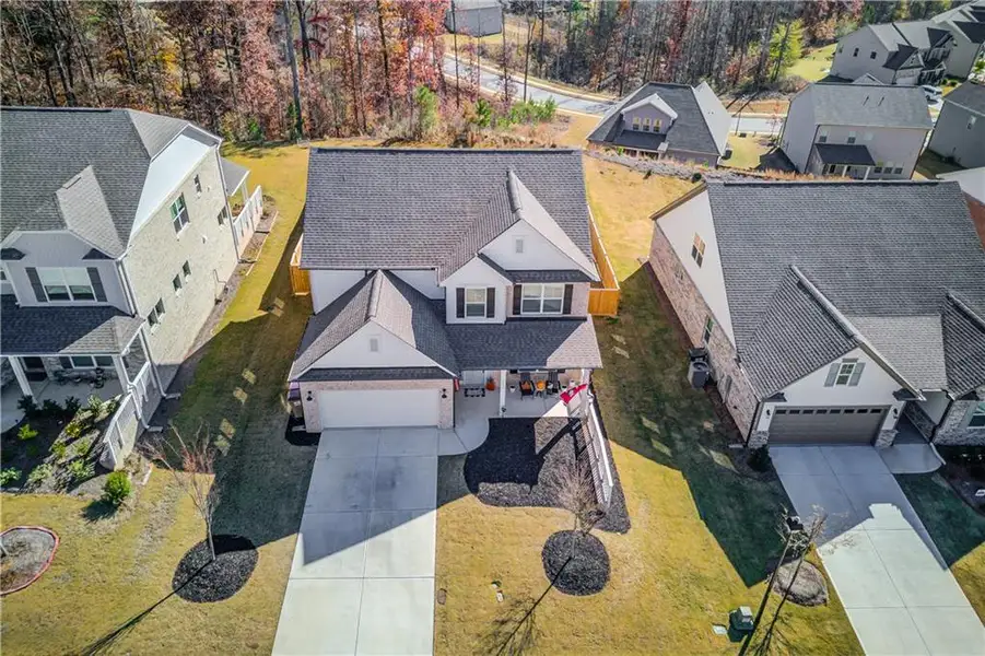 Front exterior of a new home in Cambridge, Flowery Branch, GA, highlighting curb appeal (Image 1).