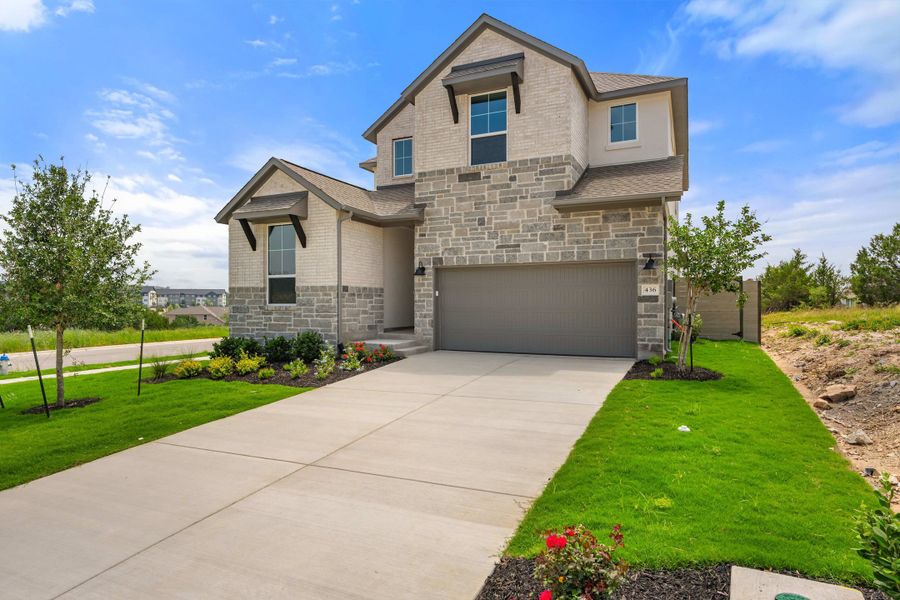 Front exterior of a new home in Wolf Ranch, Georgetown, TX, highlighting curb appeal (Image 29).