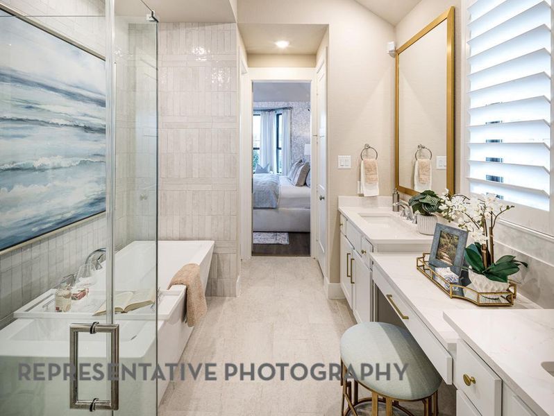Full bath featuring vanity, a bath, a shower stall, and connected bathroom Full bath featuring vanity, a bath, a shower stall, and connected bathroom