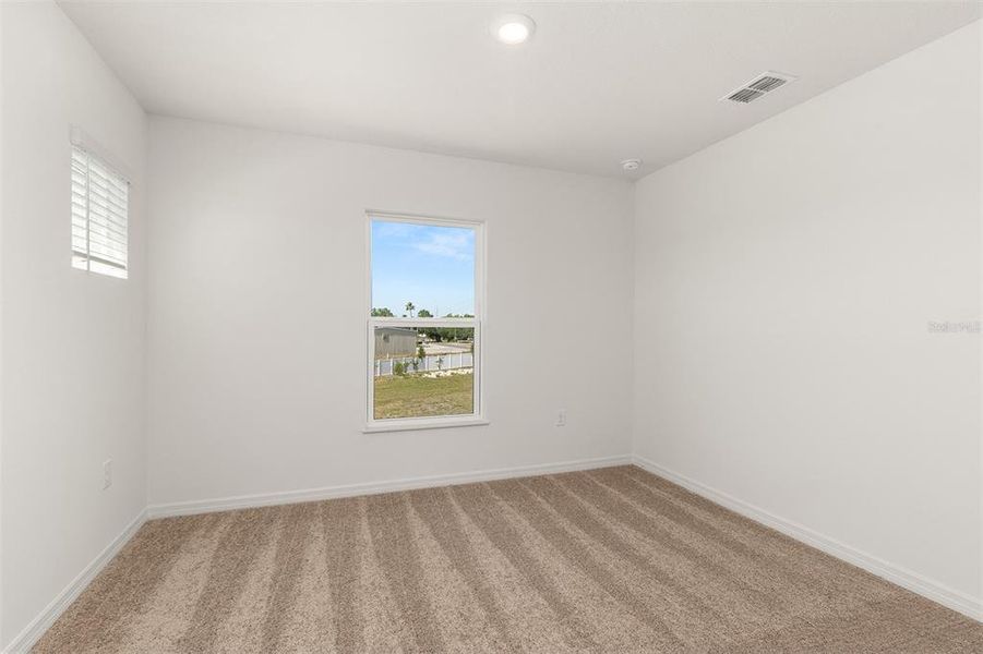 Spacious, unfurnished interior of a new home in Peach Crossings, Winter Haven (Image 18).
