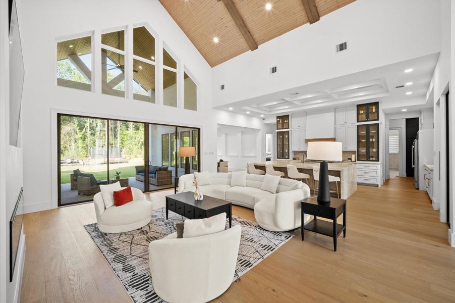 Seamless connection between the living room, kitchen, and outdoor living spaces.