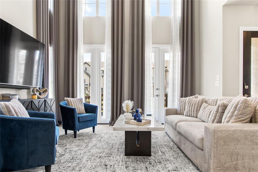 Living room featuring a high ceiling