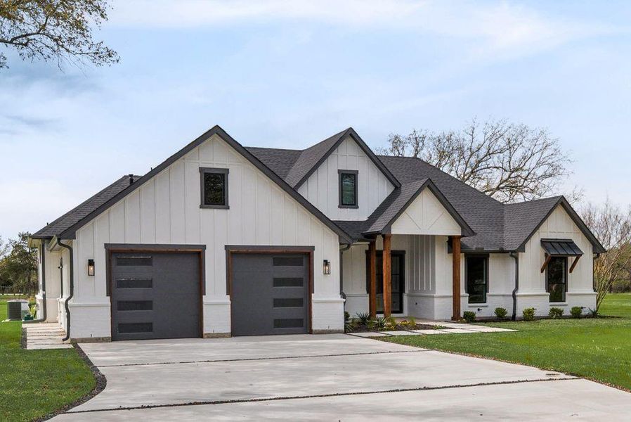 Front exterior of a new home in , Poetry, TX, highlighting curb appeal (Image 21). Front exterior of a new home in , Poetry, TX, highlighting curb appeal (Image 21).