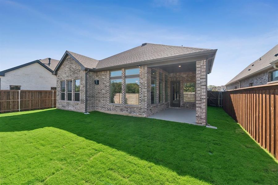 Exterior details and patio area of a home in South Pointe Cottage Series, Mansfield (Image 3). Exterior details and patio area of a home in South Pointe Cottage Series, Mansfield (Image 3).