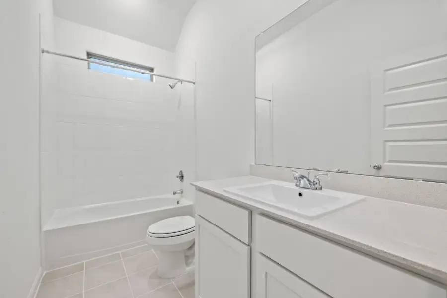 Bathroom in the Birch home plan by Trophy Signature Homes – REPRESENTATIVE PHOTO