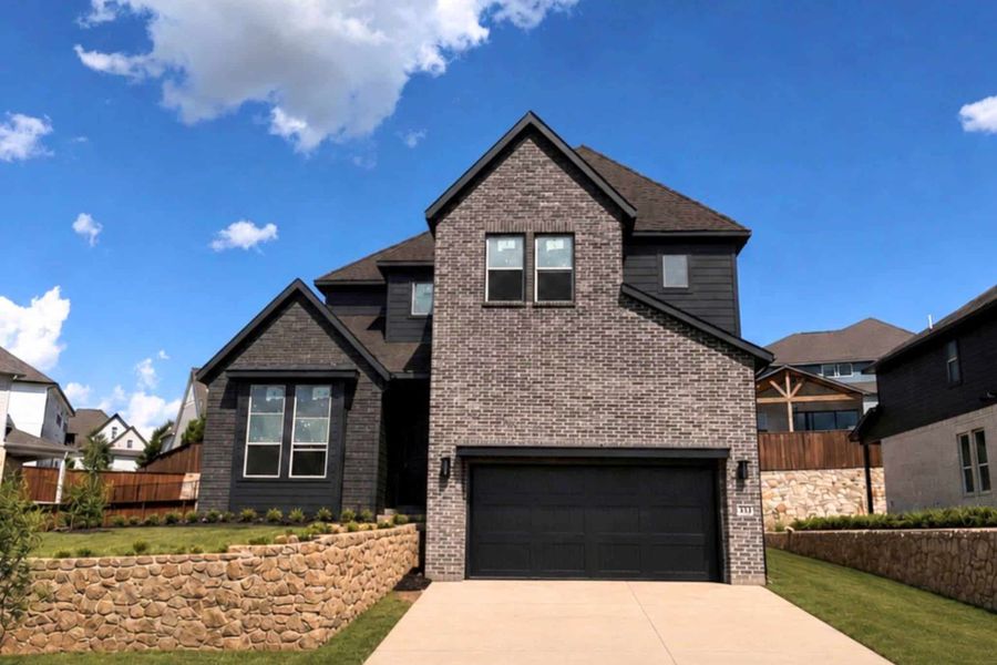 Front exterior of a new home in Walsh, Fort Worth, TX, highlighting curb appeal (Image 1). Front exterior of a new home in Walsh, Fort Worth, TX, highlighting curb appeal (Image 1).