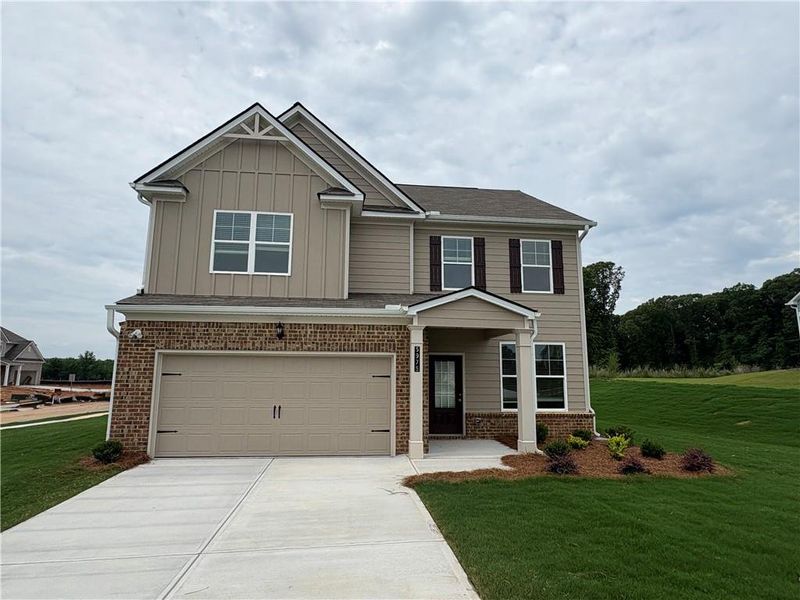 Front exterior of a new home in Highland Park, Stonecrest, GA, highlighting curb appeal (Image 16). Front exterior of a new home in Highland Park, Stonecrest, GA, highlighting curb appeal (Image 16).