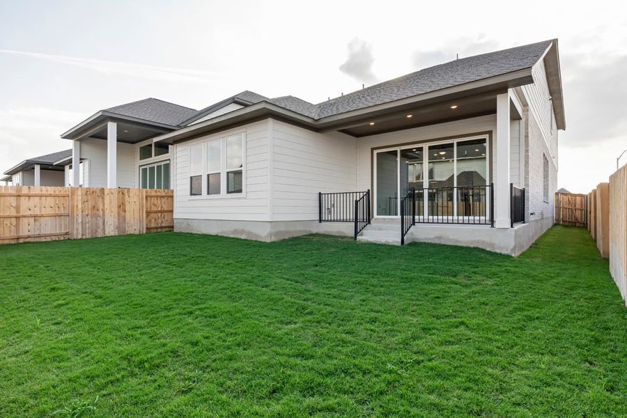 Exterior details and patio area of a home in Arbor Collection at Lariat, Liberty Hill (Image 30). Exterior details and patio area of a home in Arbor Collection at Lariat, Liberty Hill (Image 30).
