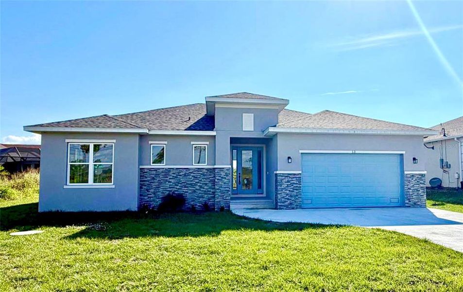 Front exterior of a new home in , Placida, FL, highlighting curb appeal (Image 2).
