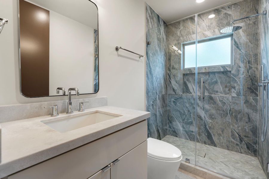 Bedroom 4 features elevated ceilings that follow the roofline, creating additional volume to the space.